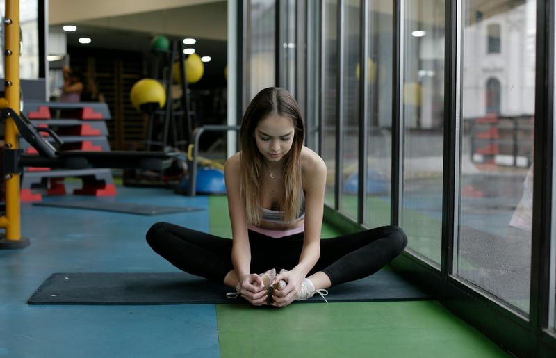 A person in deep concentration during a calm exercise moment.