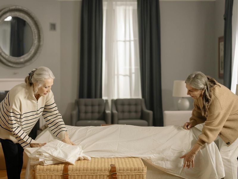 A person moving gracefully through an exercise sequence in a bright room.