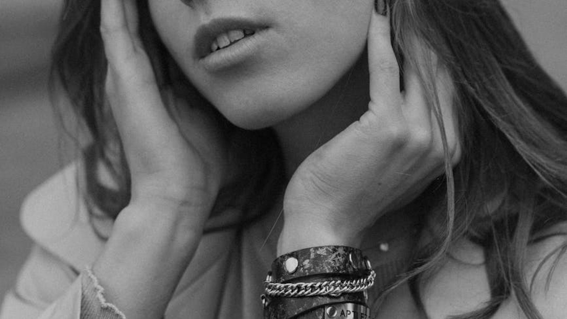 Person in a dynamic cardio pose in a spacious modern studio.